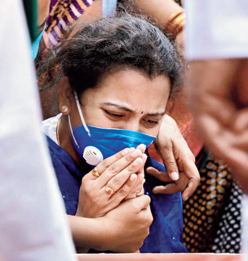 The wife of Col Santosh Babu, the commanding officer who was killed in Ladakh on Monday, mourns near his mortal remains
at their home in Suryapet, Telangana, on Thursday.
