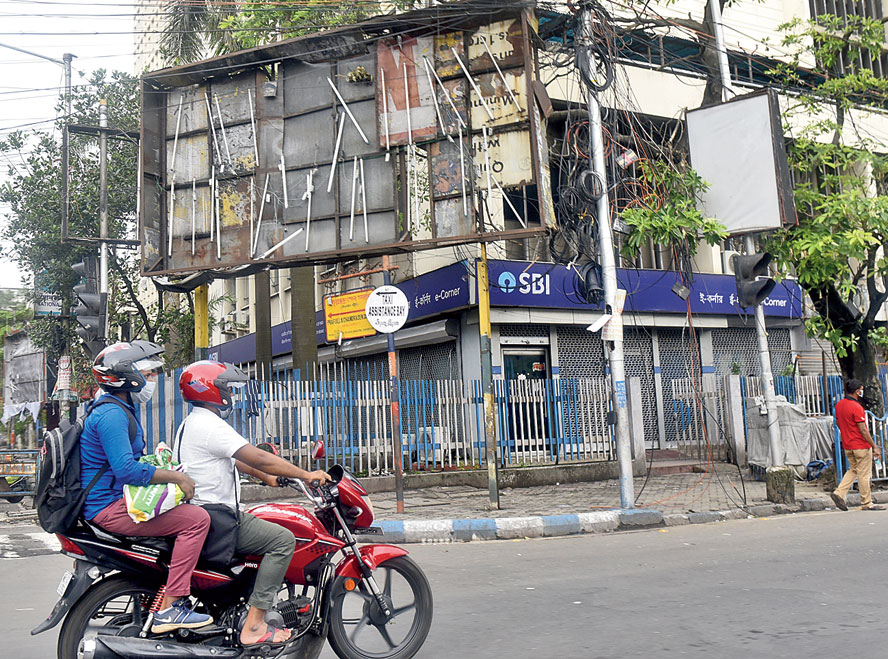 Cyclone Amphan blew off the flex of a billboard on Chowringhee Road, exposing the tubelights. The picture was taken on Saturday