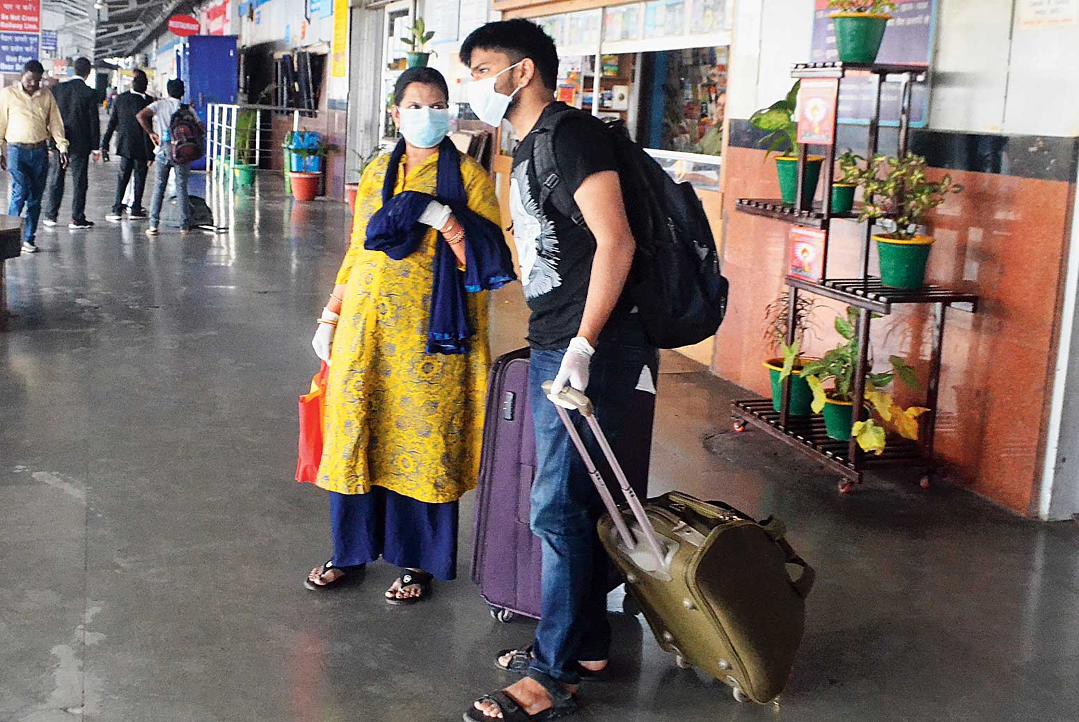 Passengers with faces covered at Tatanagar station on Wednesday.