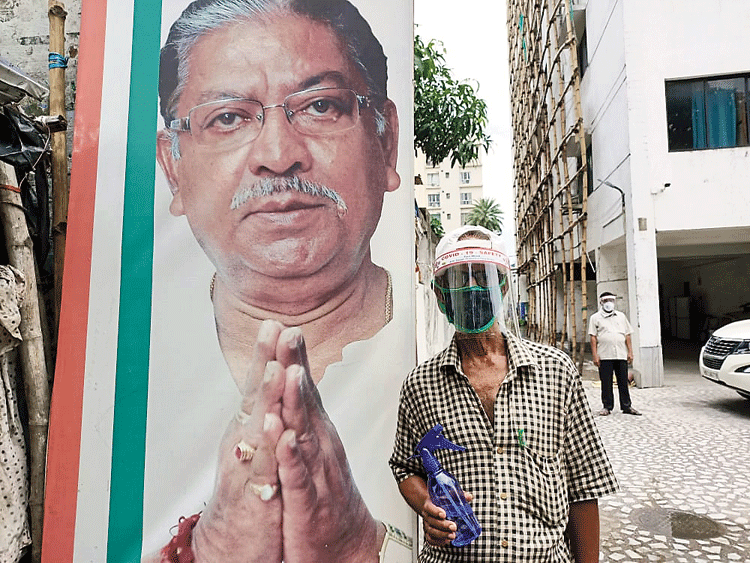 A man with a sanitiser outside the Bidhan Bhavan.