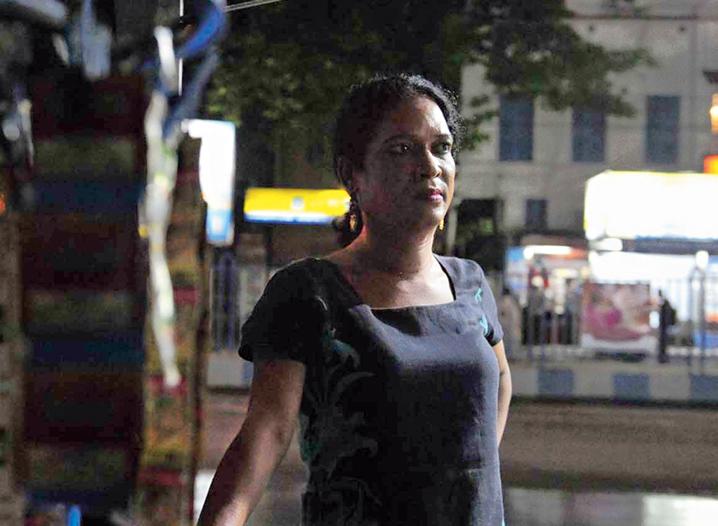 Julie at her cigarette stall.