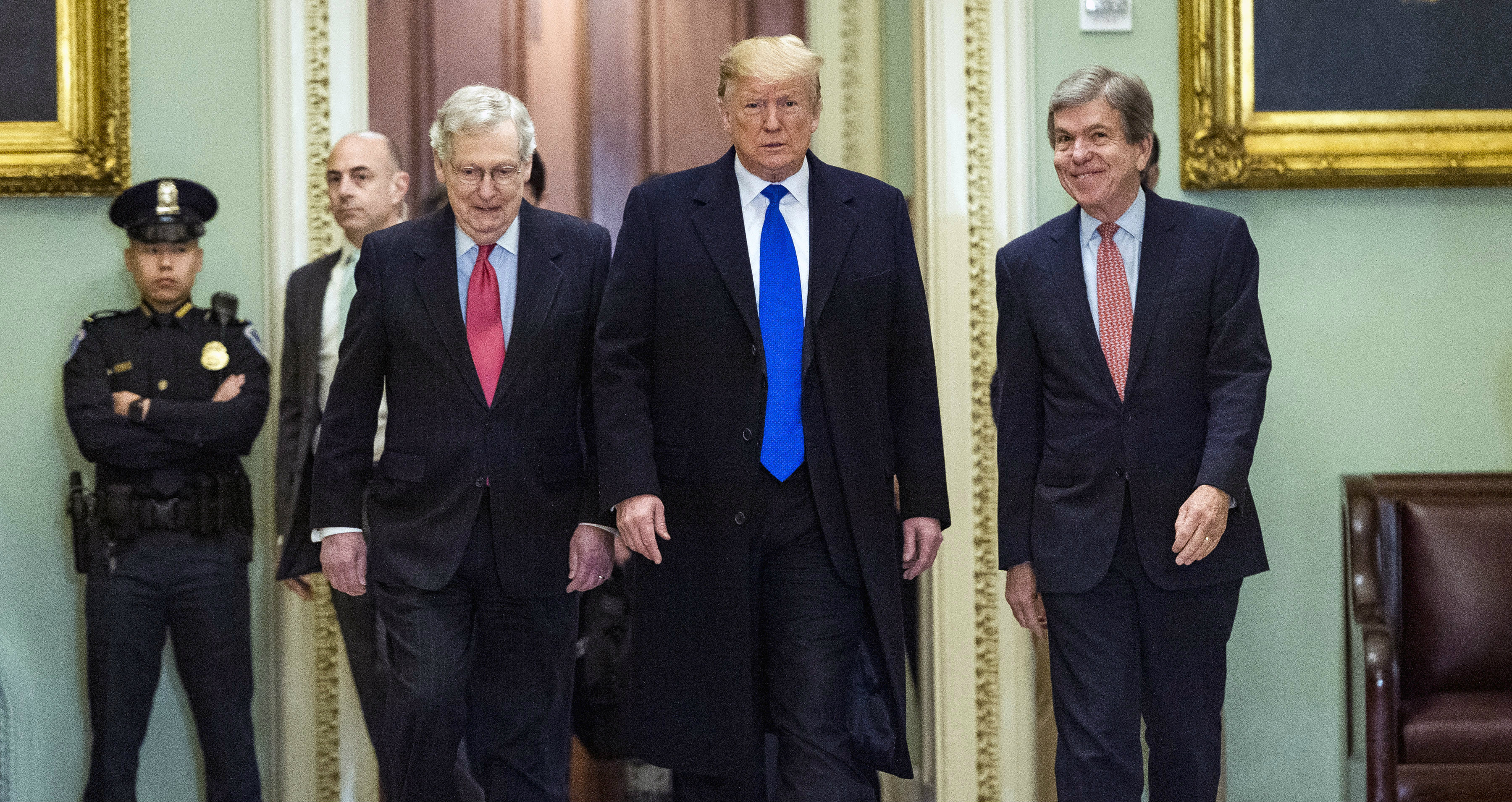 Donald Trump is flanked by Senate Majority Leader Mitch McConnell (left) and Sen. Roy Blunt as he arrives for a luncheon with Senate Republicans at the Capitol on Tuesday.