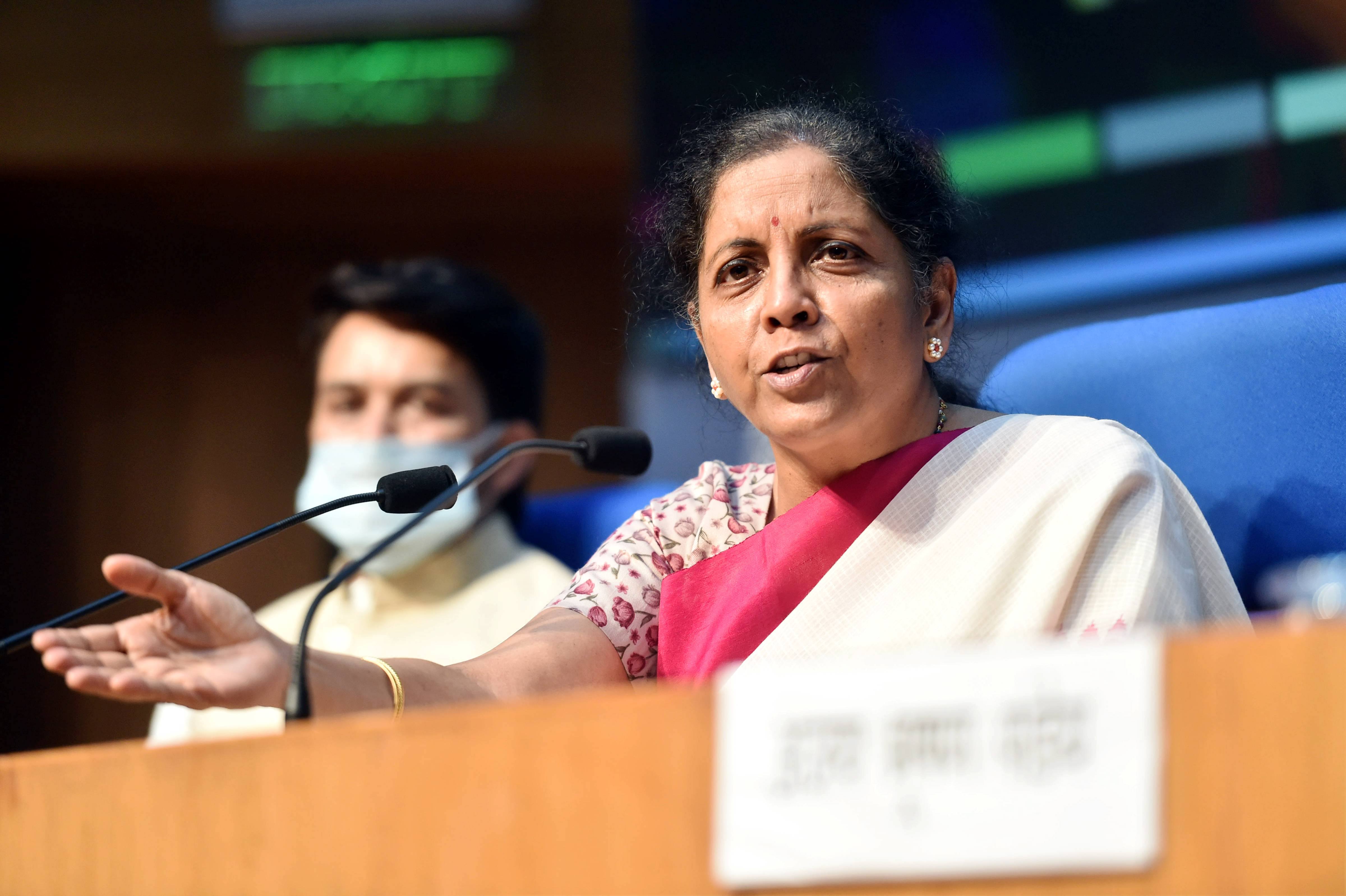 Union Finance Minister Nirmala Sitharaman addresses a press conference as MoS for Finance Anurag Thakur looks on, in New Delhi, Friday, May 15, 2020. 