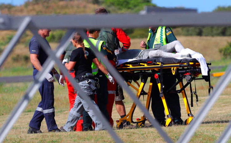 An injured person is given medical help at the Whakatane Airfield after the volcanic eruption on December 9 on White Island, New Zealand