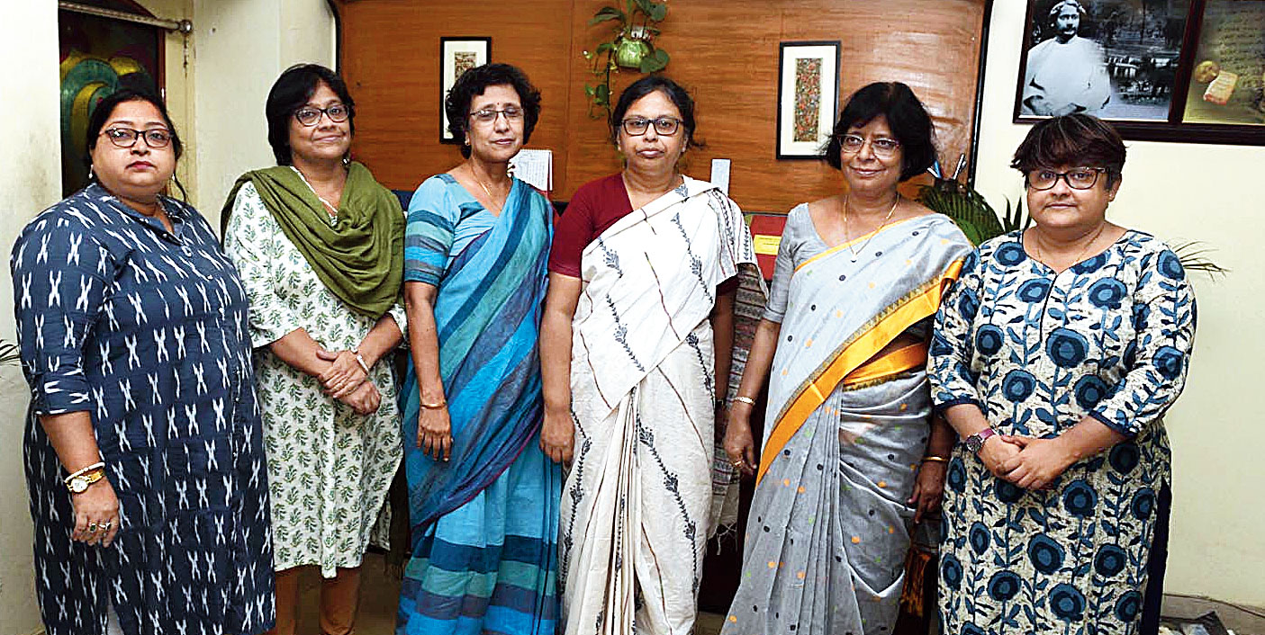 Some of the college teachers, including the principal (second from right), who contribute funds for the midday meal