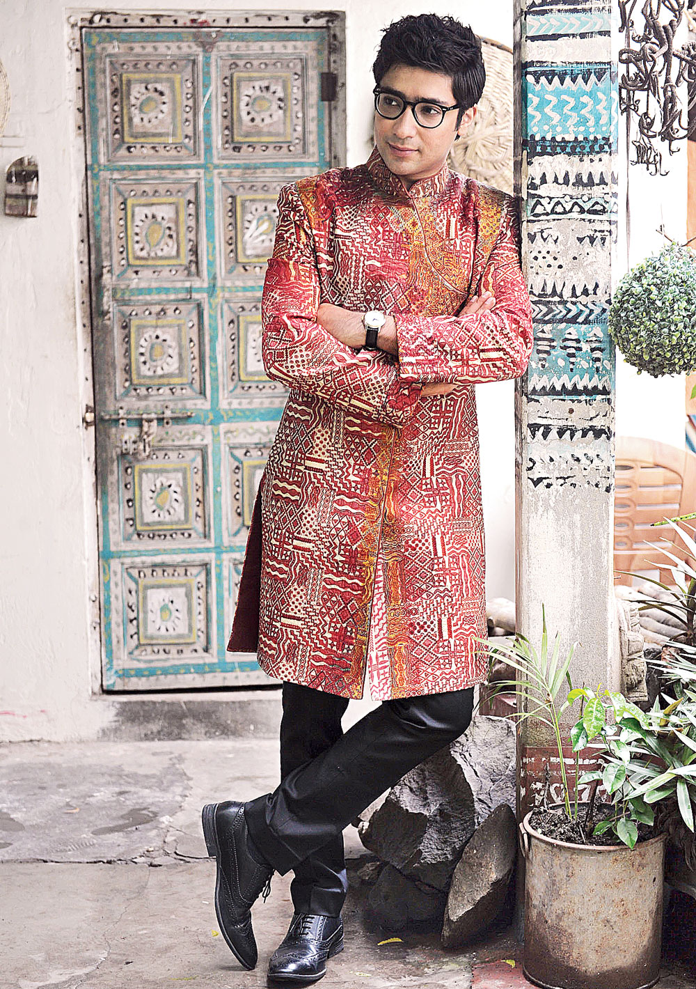Cocktail look: Formal, yet with a touch of tradition. This raw silk bandhgala sherwani with aari-tari work lets you do just that, teamed with a pair of black trousers