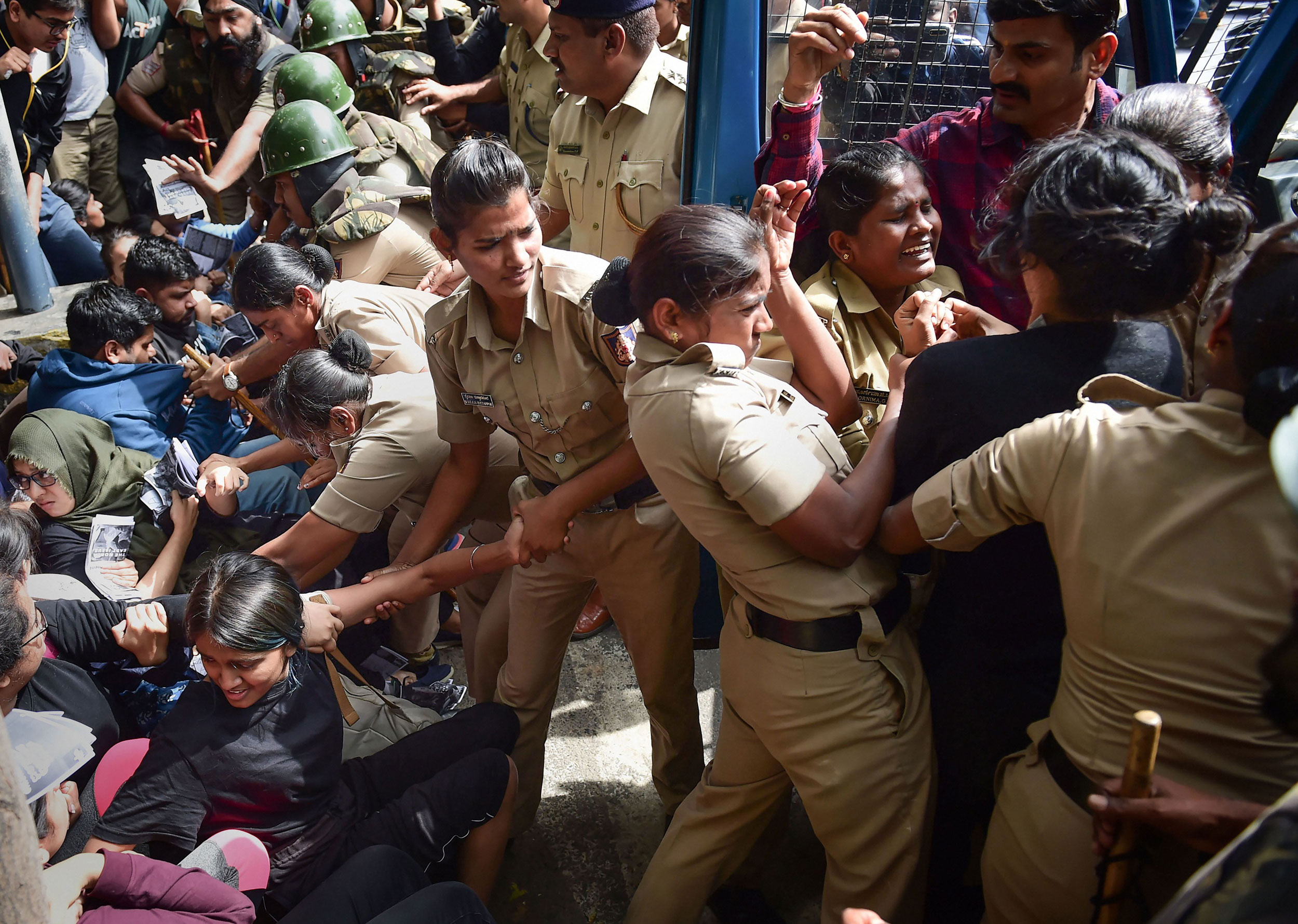 Protesters detained by police for defying prohibitory orders imposed in the area during an anti-Citizenship Act protest rally in Bangalore.
