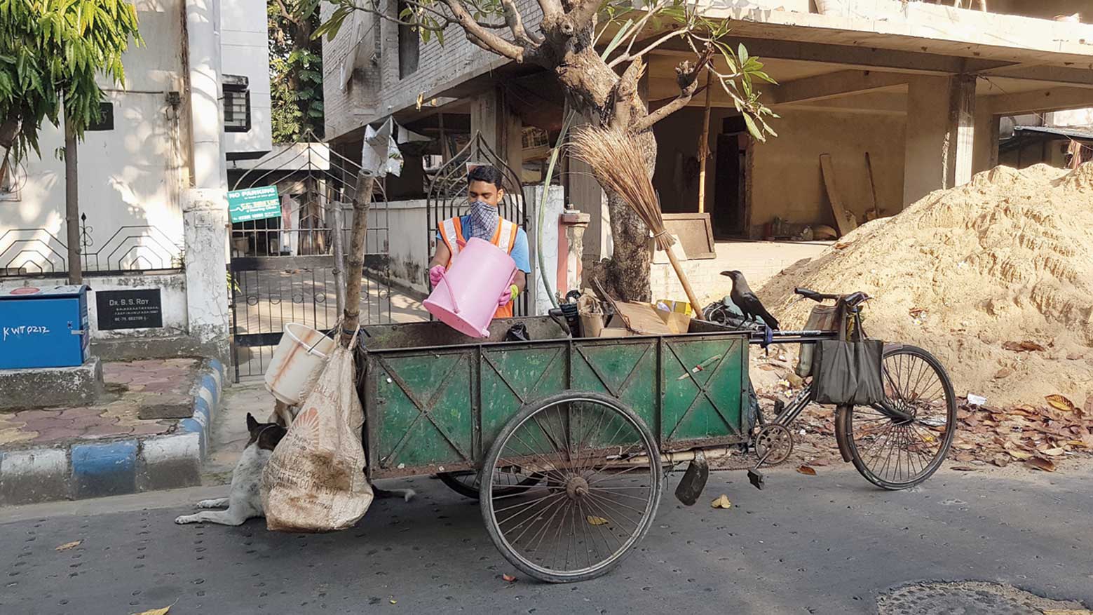 Garbage collector Sonu Das empties a bin in BE Block