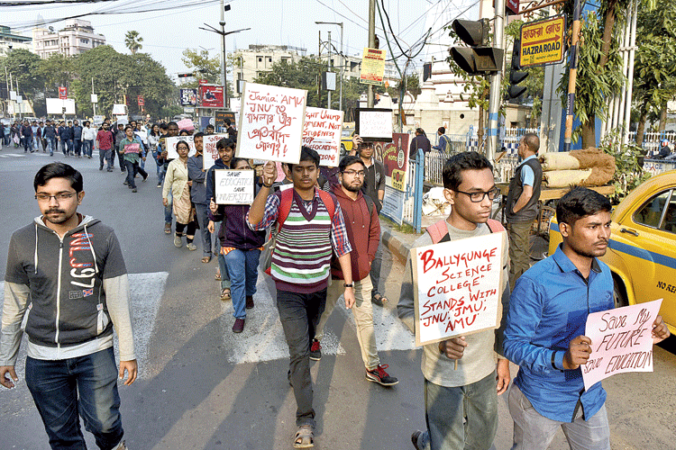 Students walk in the protest march on Monday