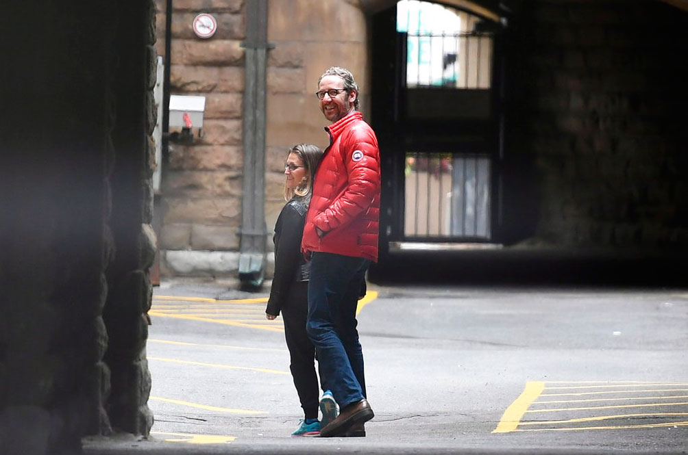 Minister of foreign affairs Chrystia Freeland and Gerald Butts, senior political adviser to Prime Minister Justin Trudeau, walk in the loading dock of the Office of the Prime Minister and Privy Council, in Ottawa, on Sunday.