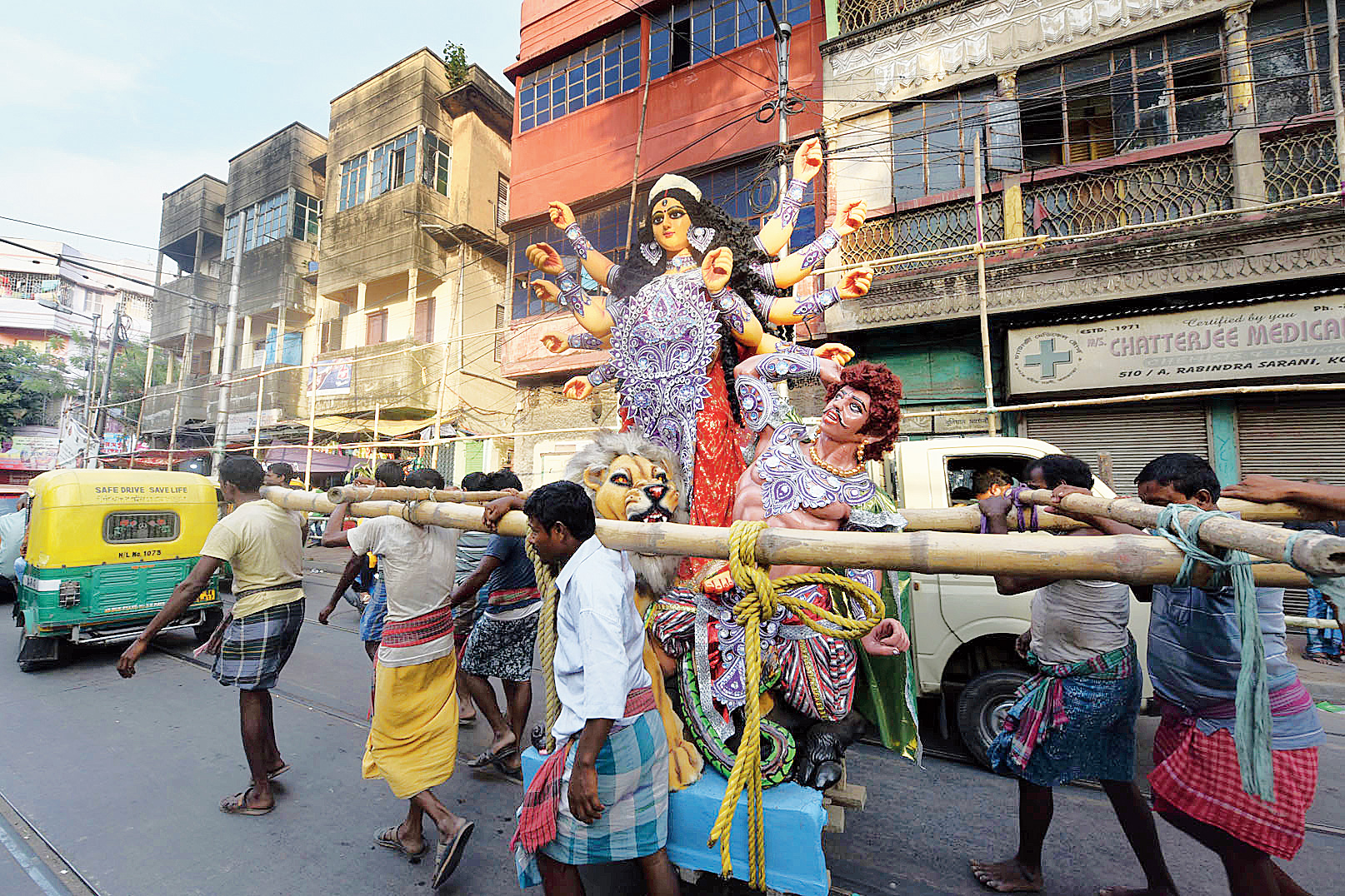 A Durga idol on its way to a pandal from Kumartuli on Monday.