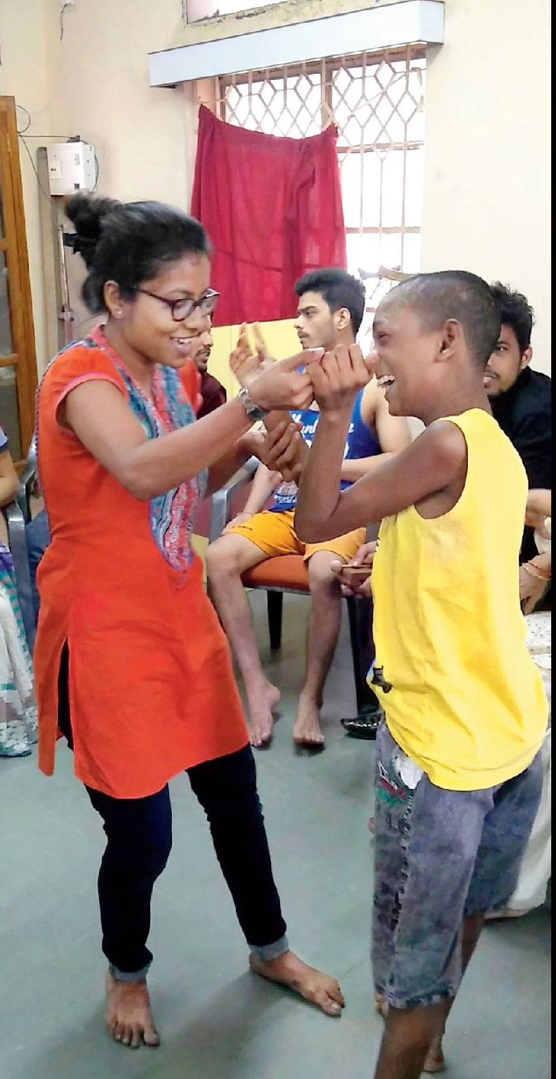 Rishi dances as the others sing