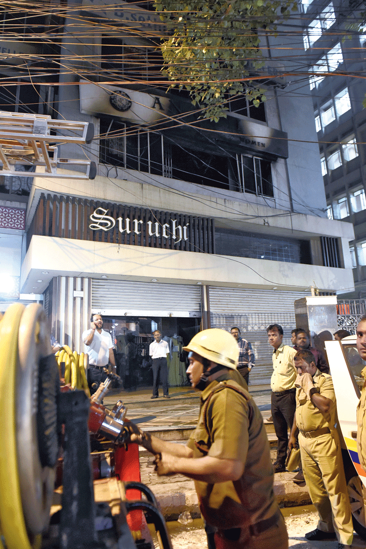 Firemen outside the commercial building on Thursday evening.