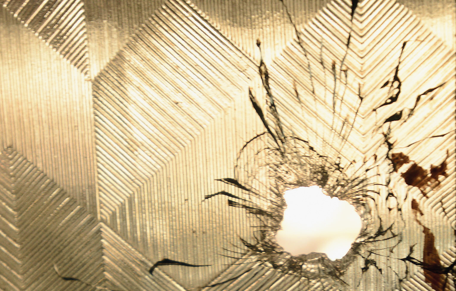 An alleged bullet hole in the house of Javed Qureshi.