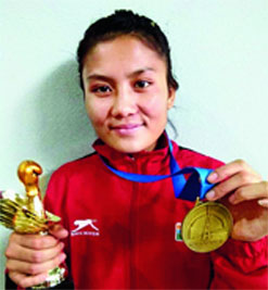 Tingmila Doungel shows off the gold medal she won in the 13th Silesian Boxing Championship in Poland in September
