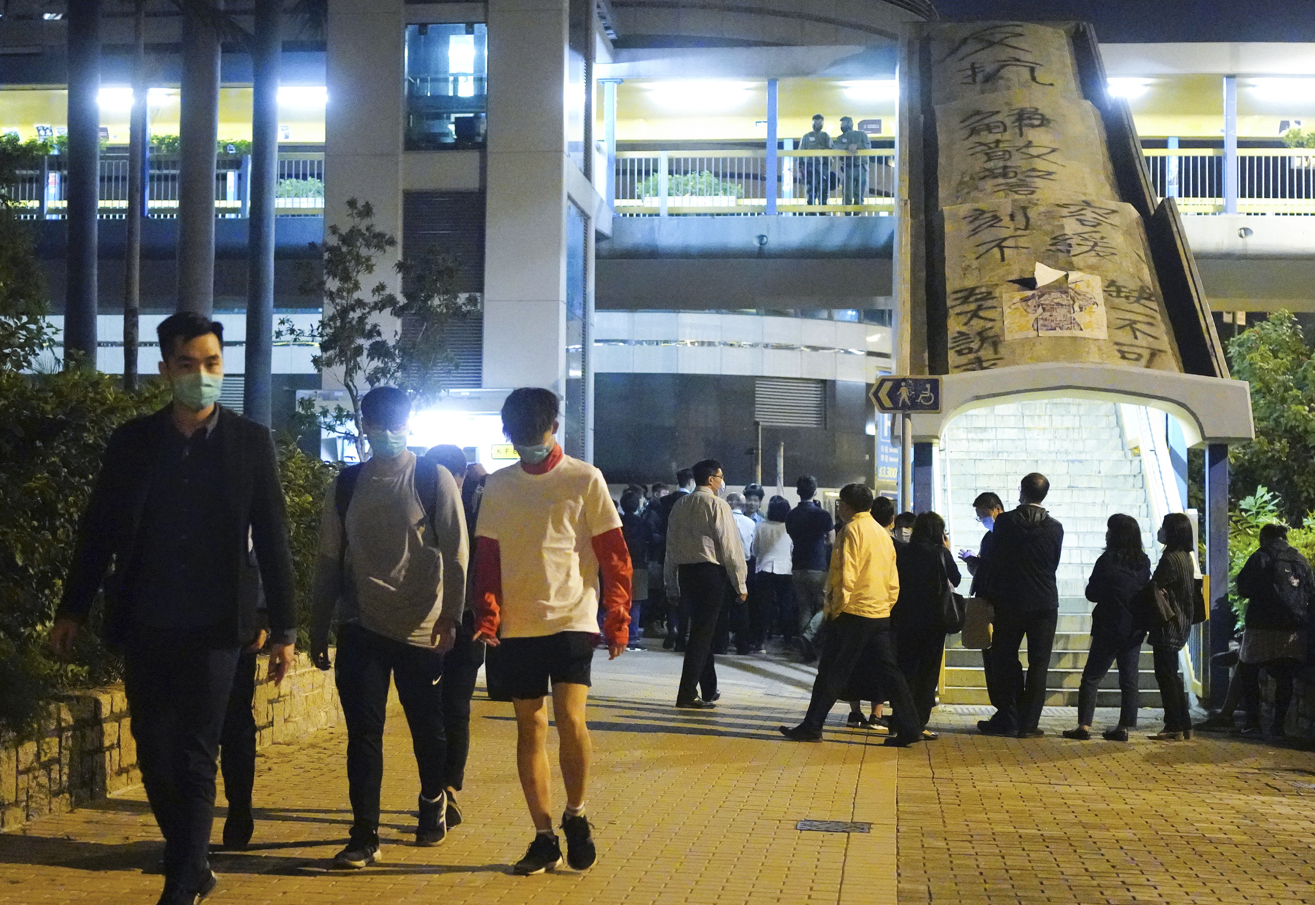 Students under 18 walk after being released from Hong Kong Polytechnic University campus in Hung Hom district, Hong Kong, on November 18, 2019