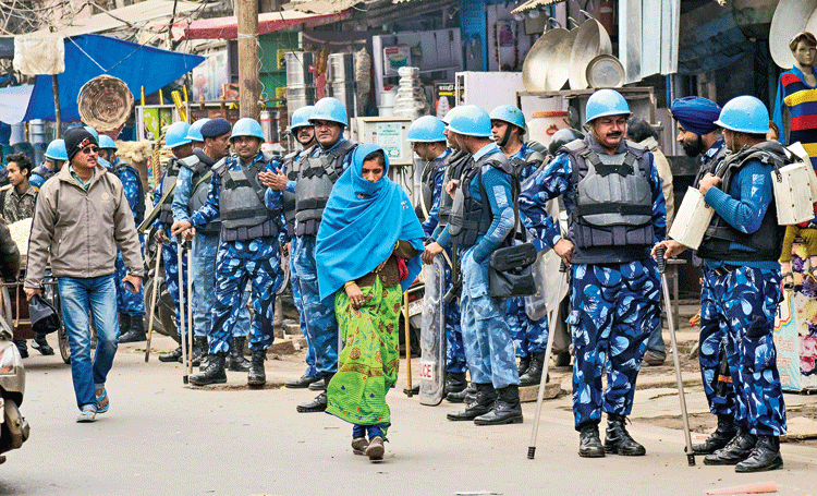 Rapid Action Force personnel stand guard in Allahabad on Friday. Around 3,500 jawans of central paramilitary forces and 12,000 of the Uttar Pradesh Provincial Armed Constabulary were deployed across the state, with the streets resembling Kashmir. 