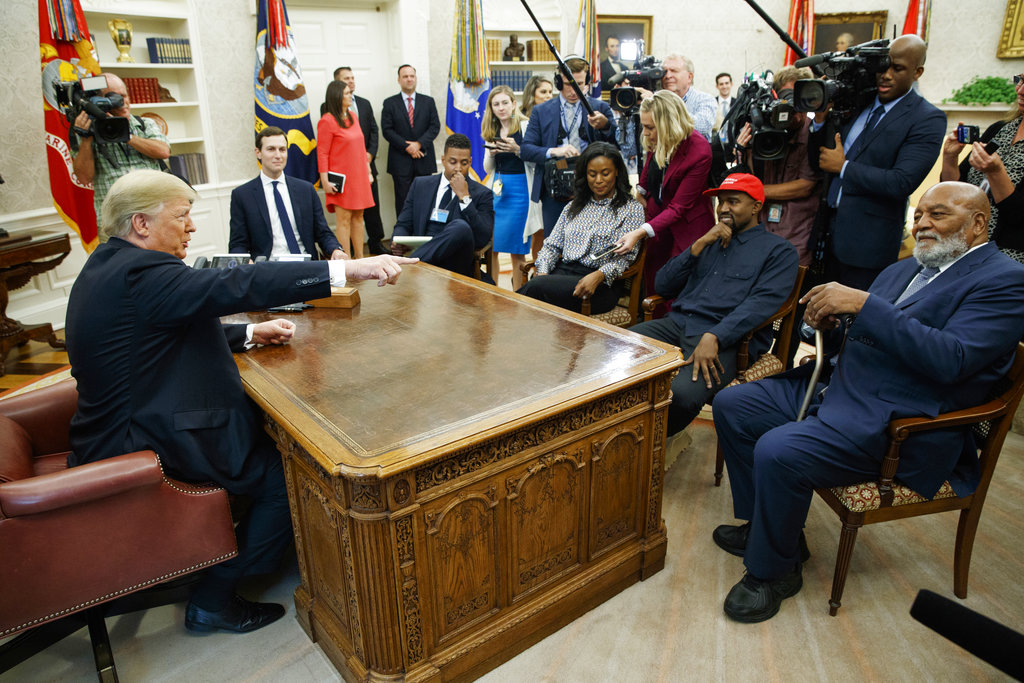 Trump gestures at former football player Jim Brown in the Oval Office on Thursday.