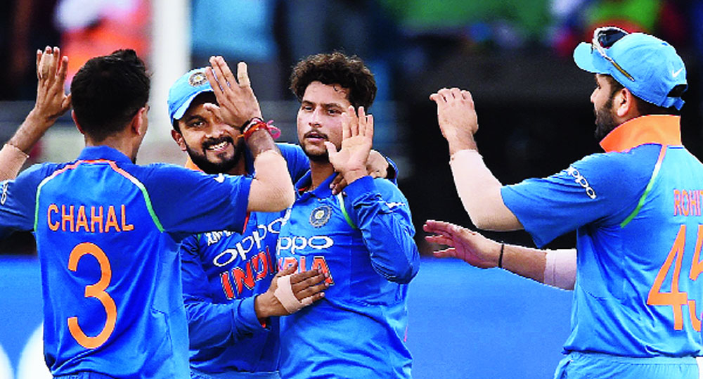 Kuldeep Yadav celebrates with teammates after dismissing Mahmudullah during the Asia Cup final in Dubai on Friday