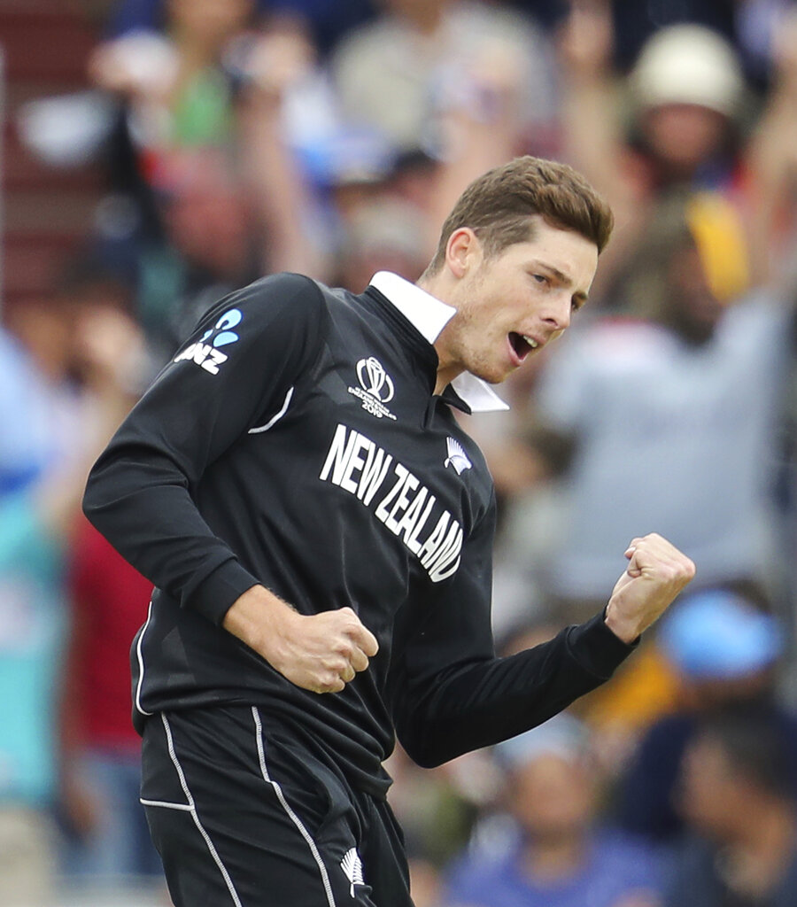 New Zealand's Mitchell Santner celebrates the dismissal of India's Rishabh Pant during the Cricket World Cup semifinal match between India and New Zealand at Old Trafford in Manchester, Wednesday, July 10, 2019.