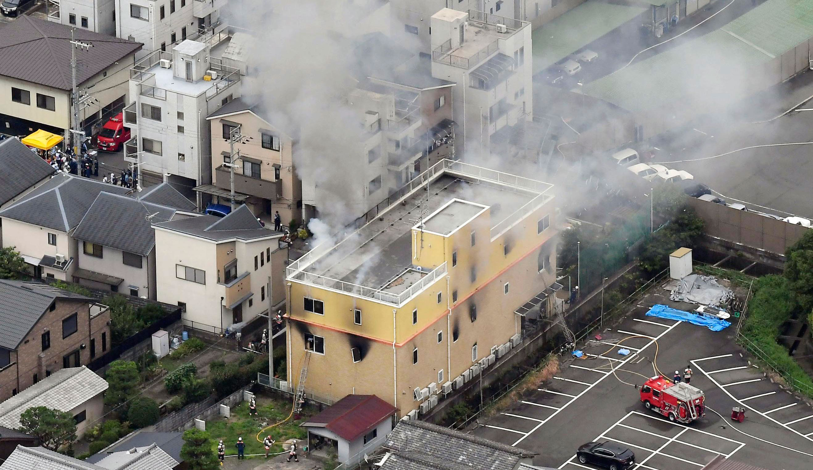 Firefighters battle fires at the animation studio in Kyoto on Thursday after a man doused the building with what appeared to be petrol. 