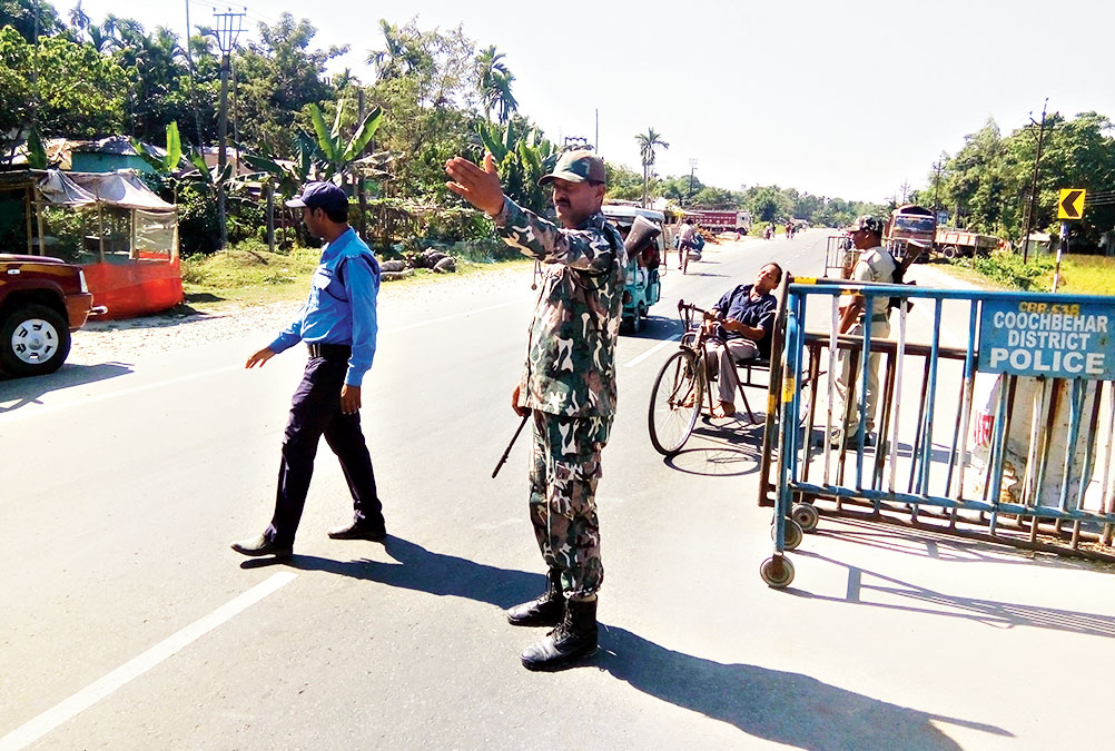 Police at Langalgram in Buxirhat, near the Assam border, on Friday. 