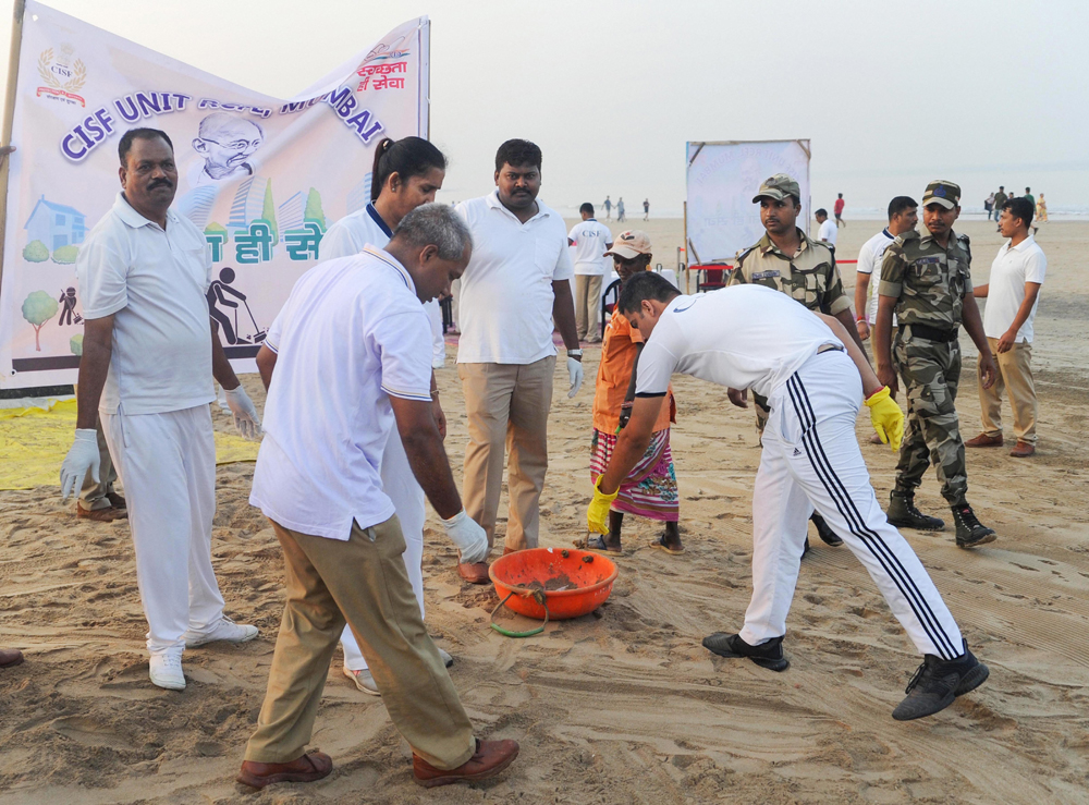 CISF personnel during a cleanliness drive at Juhu beach in Mumbai on December 10