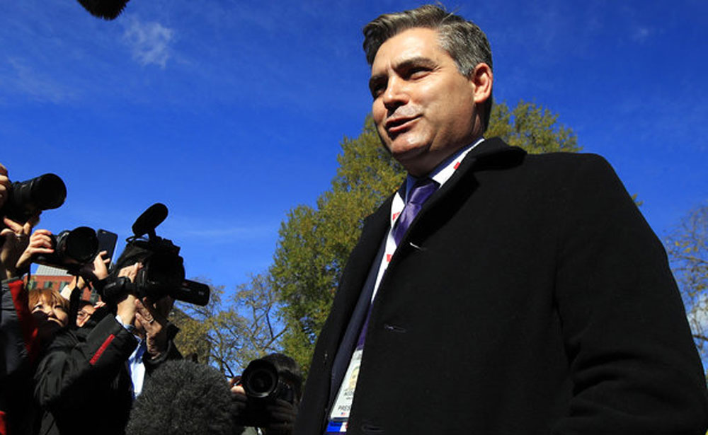 CNN's Jim Acosta speaks to journalists on the North Lawn upon returning to the White House in Washington on Friday.