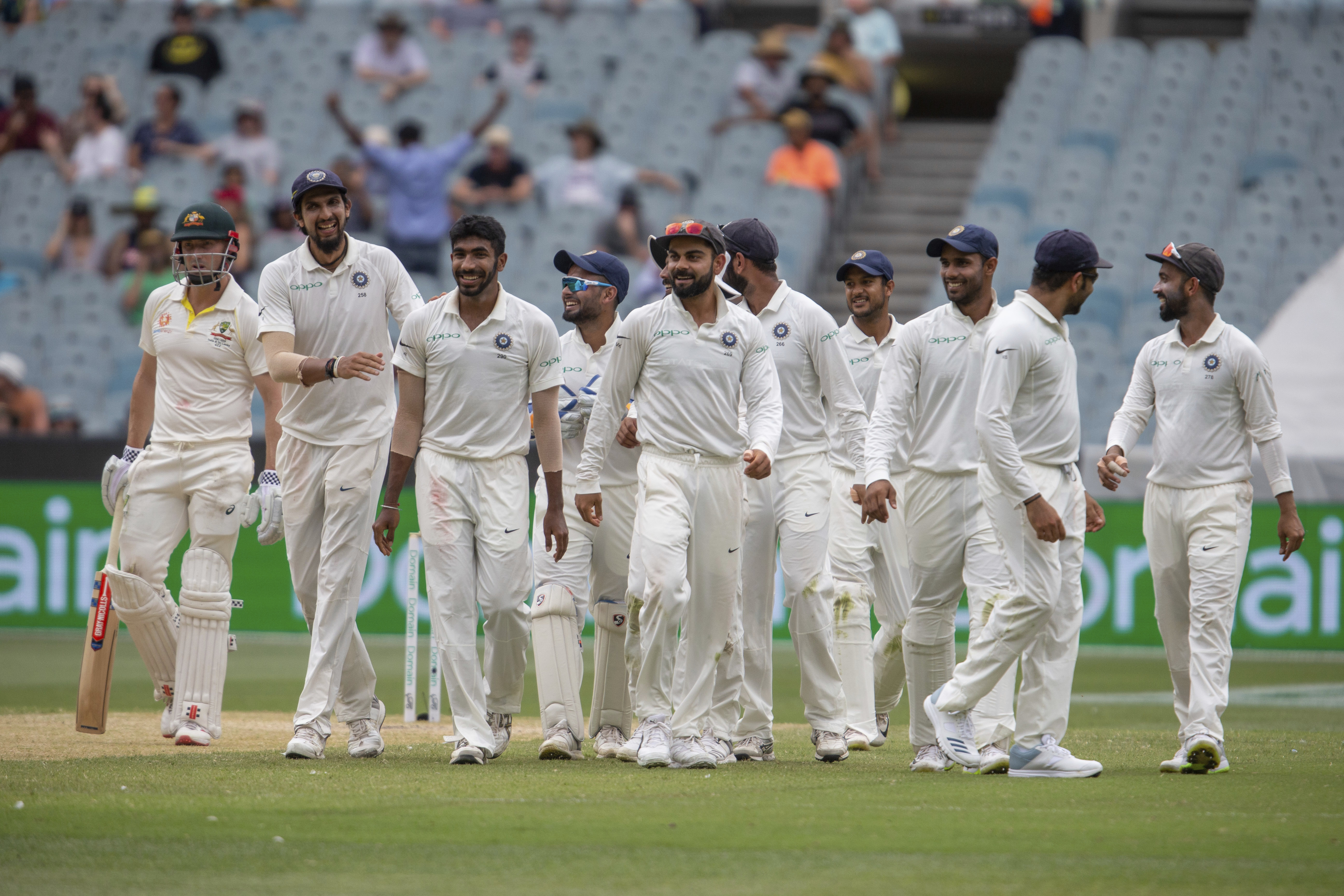 Indian team members walk off the field for lunch, led by captain Virat Kohli, centre, on day three of the third cricket test between India and Australia in Melbourne on Friday, December 28, 2018