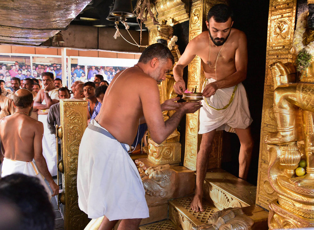 Priests carry out 'purification' of the Ayyappa temple after two women in their early 40s entered the shrine and offered prayers, in Sabarimala, Kerala on Wednesday, January 2, 2019