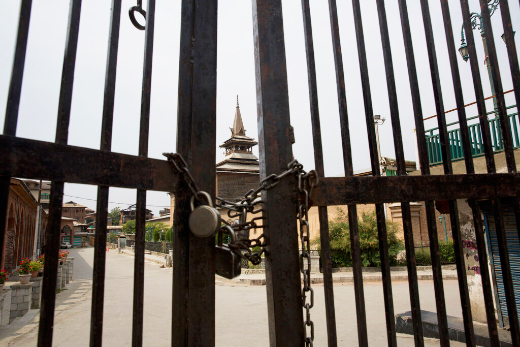 The gate of the grand mosque stands locked during restriction in downtown Srinagar on Friday
