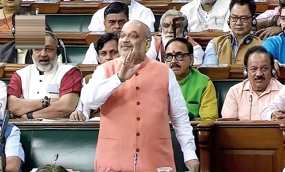 Amit Shah speaks in the Lok Sabha on Tuesday.