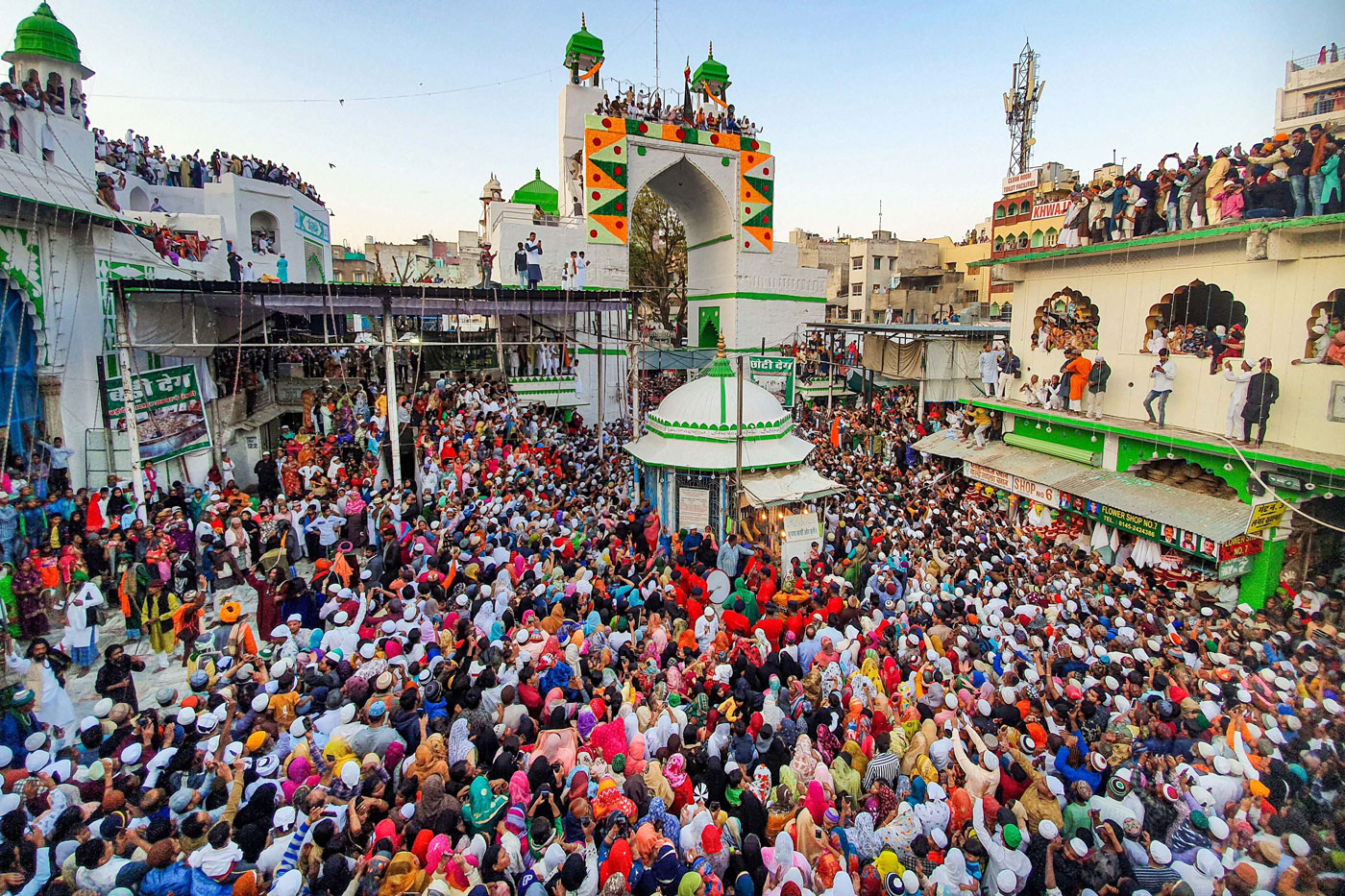 Muslim devotees gather to attend the flag hoisting ceremony ahead of the annual urs at Ajmer dargah in Ajmer, Rajasthan