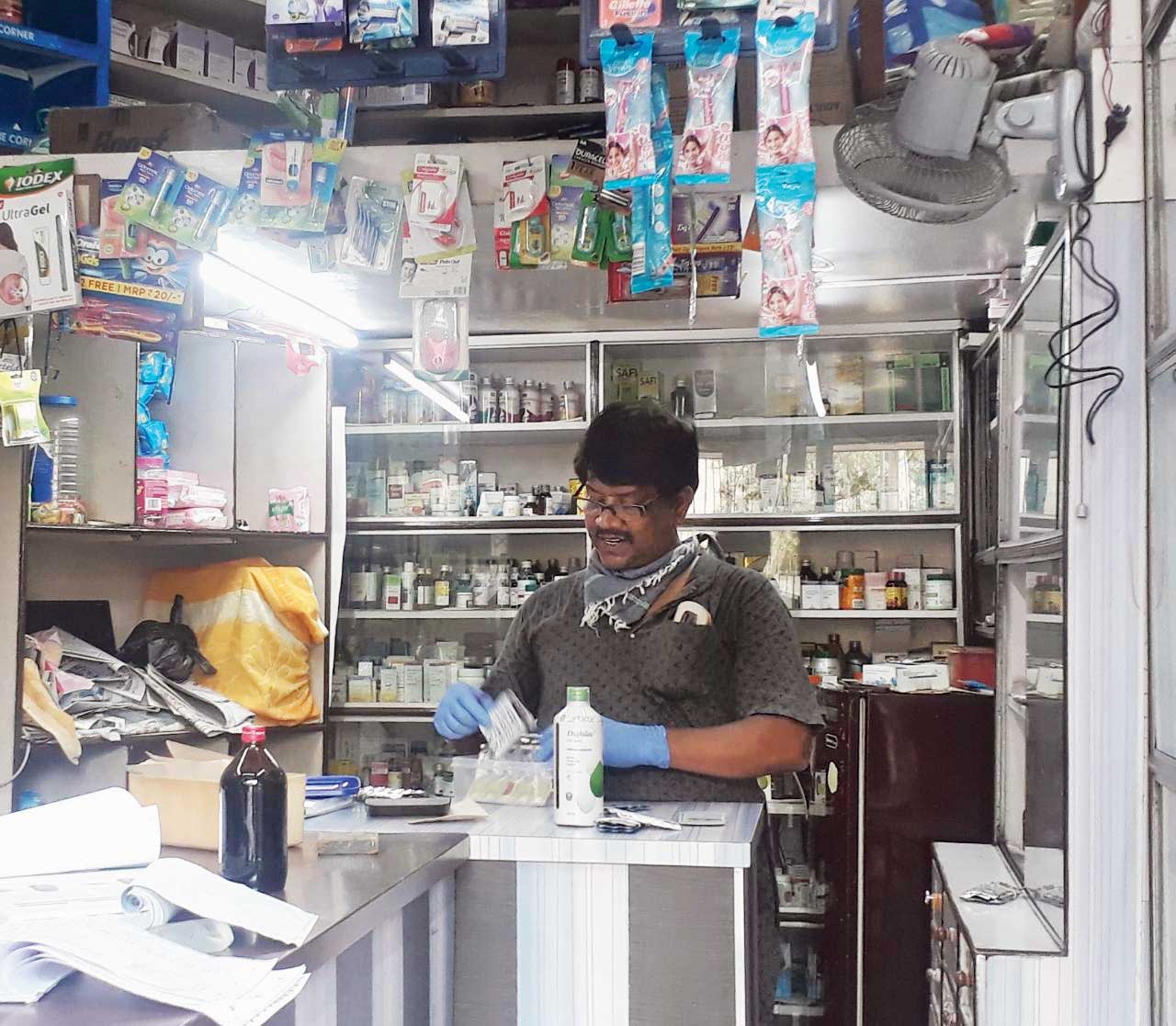 Ajoy Das sorts pills at AE Block’s Relief medicine shop