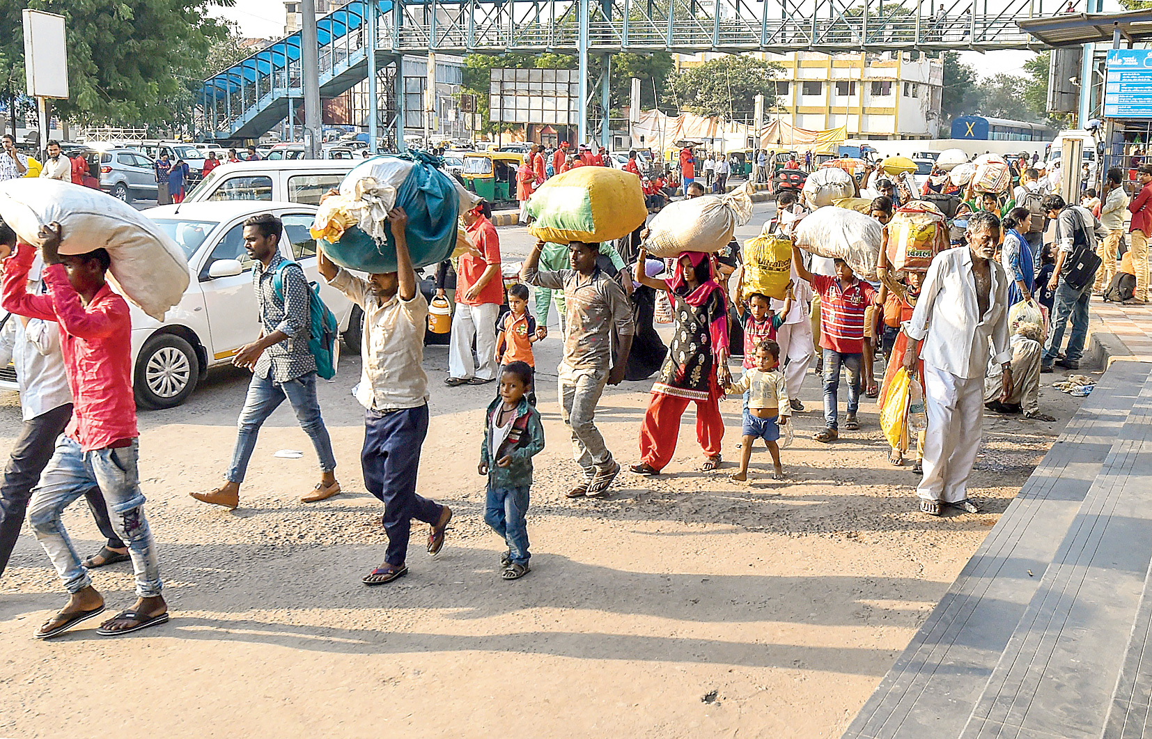 Migrant workers from Uttar Pradesh and Bihar leave Ahmedabad for their homes on Monday. 