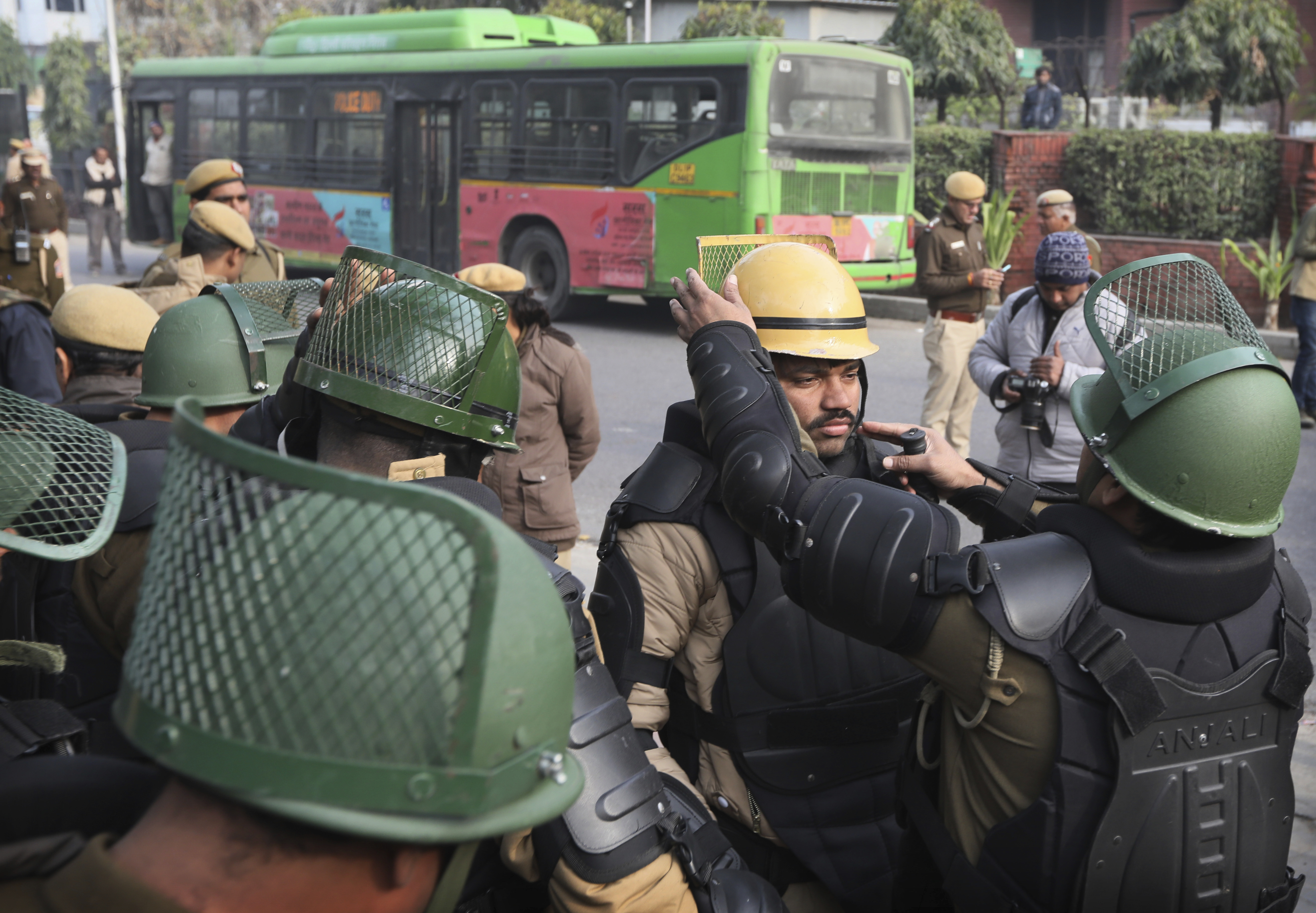 Policemen get ready for a protest call by students and activists against the citizenship law and violence by police in Uttar Pradesh state, in New Delhi, India, on December 27, 2019