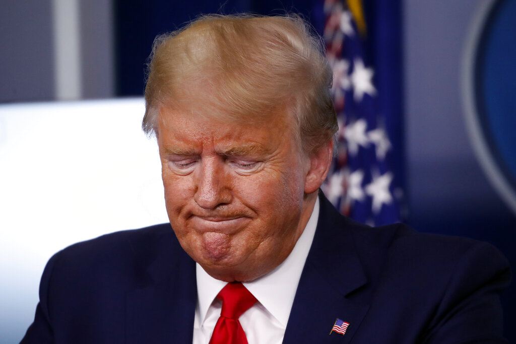 President Donald Trump pauses during a briefing about the coronavirus in the James Brady Press Briefing Room of the White House, Tuesday, March 31, 2020, in Washington. 