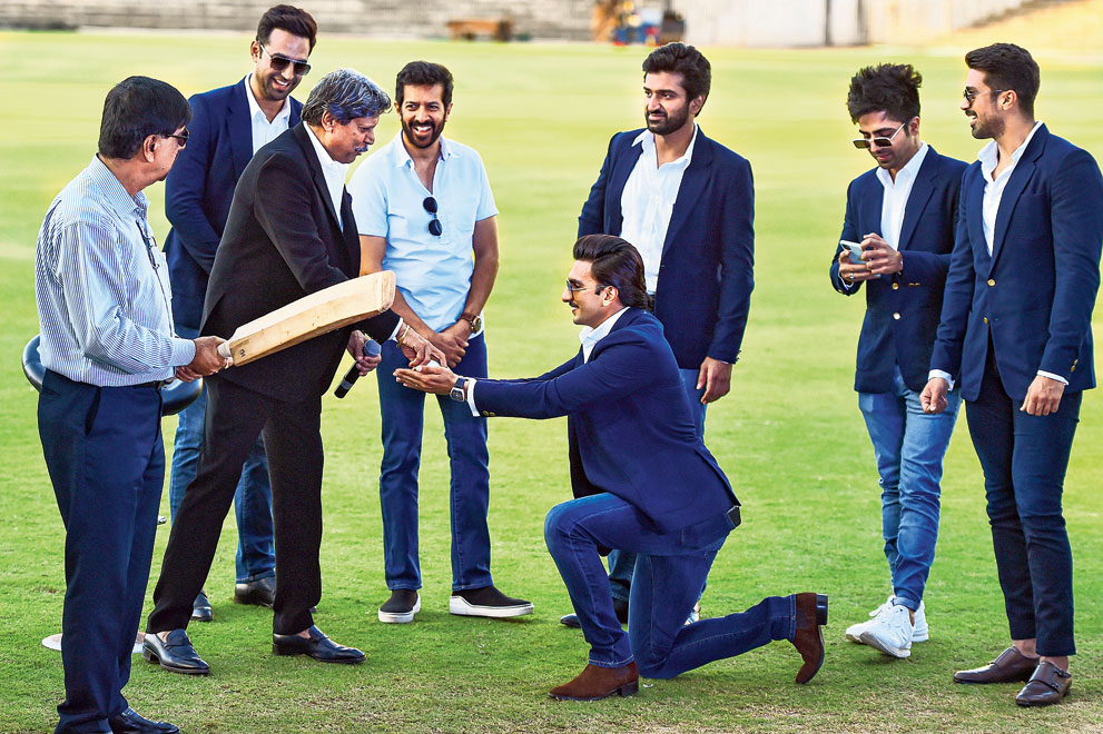 Actor Ranveer Singh shares a light moment with Kapil Dev as Krishnamachari Srikkanth (left), director of  the movie 83 Kabir Khan (fourth from left) and other members of the cast watch during a promotional at the MA Chidambaram Stadium in Chennai on Saturday