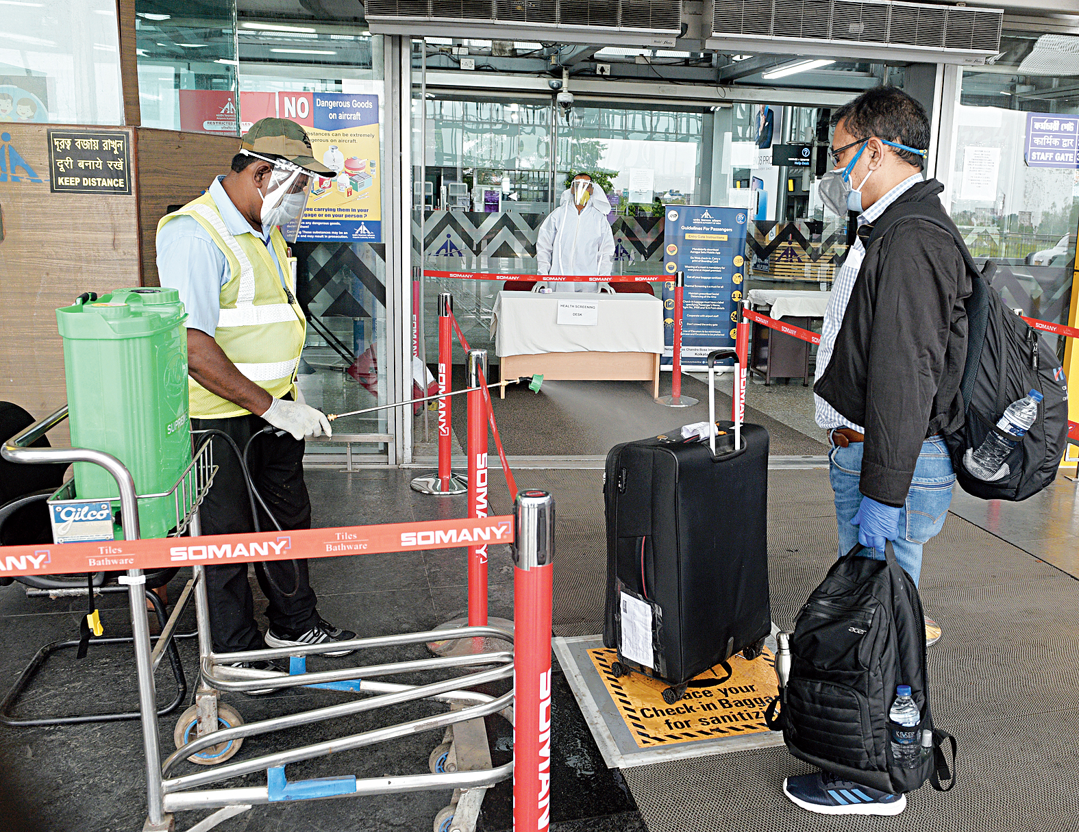 Sanitiser spray awaits passenger’s bags at the entrance of the terminal. Both check-in and cabin baggage are sanitised.