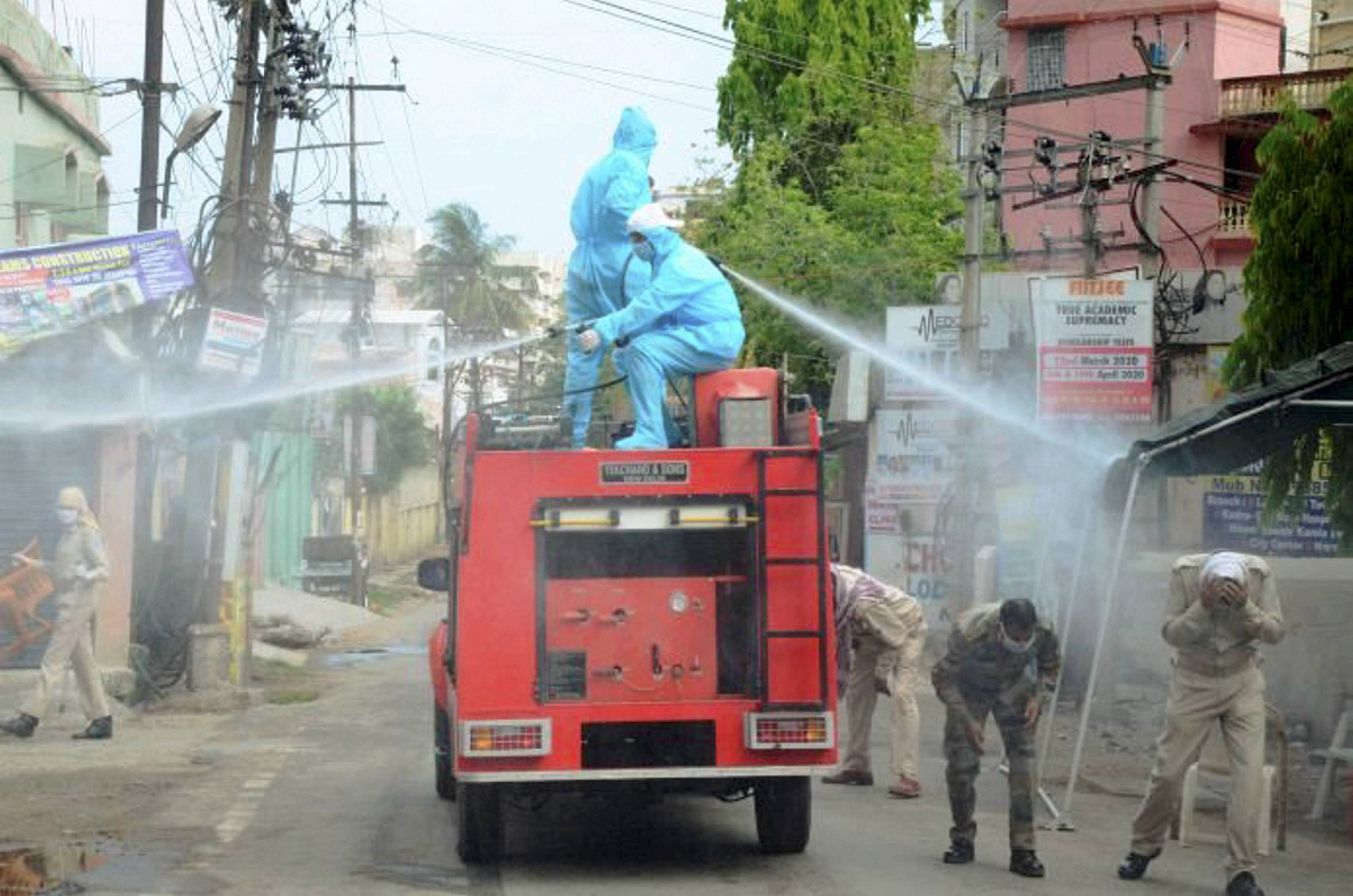 Municipal corporation workers sanitize a hotspot area of Hindpiri during the nationwide lockdown, to curb the spread of Coronavirus, in Ranchi, Thursday, April 23, 2020