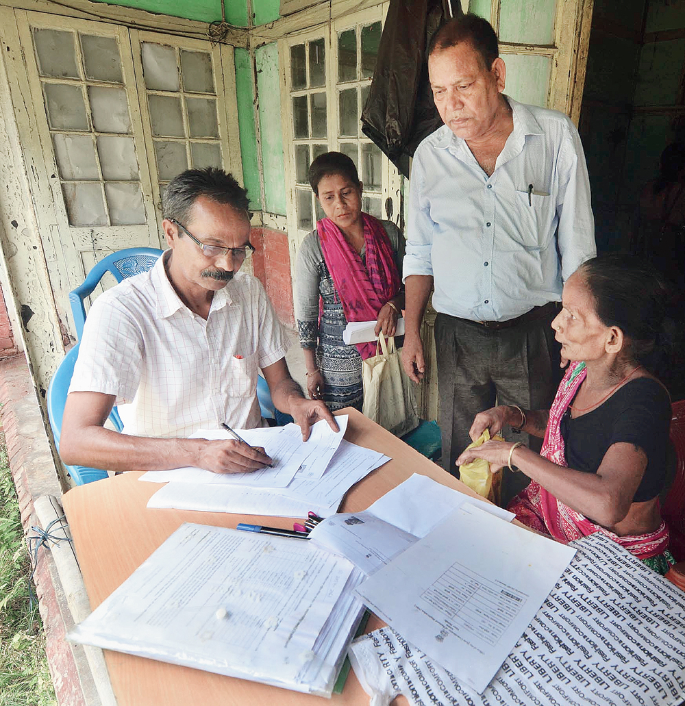 Applicants get their documents verified at an NRC Seva Kendra in Guwahati on Wednesday