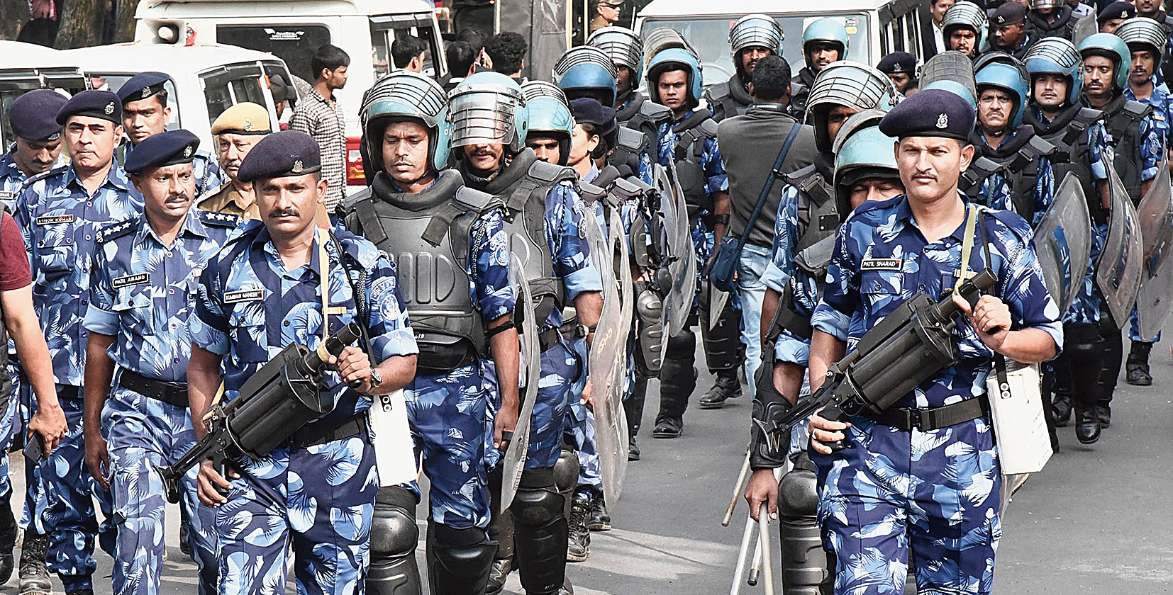 Rapid Action Force personnel patrol a street in Guwahati on Monday. 