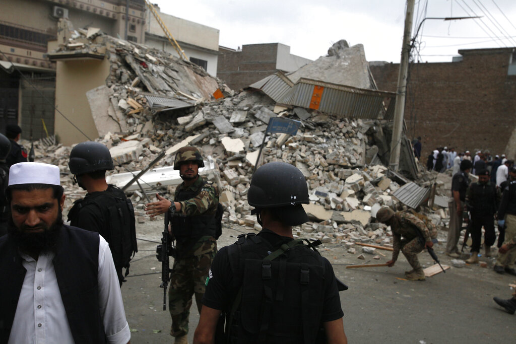 Pakistani security forces demolish the hideout of militants in Peshawar, Pakistan, Tuesday, April 16, 2019. 