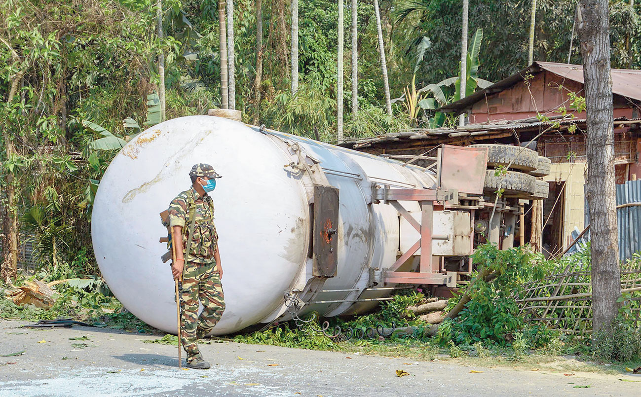 A jawan gaurds a fuel tanker after it met with an accident near Rangia in Kamrup district on Tuesday. 