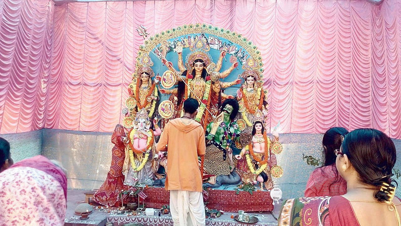 A priest performs puja at the same venue this year.
