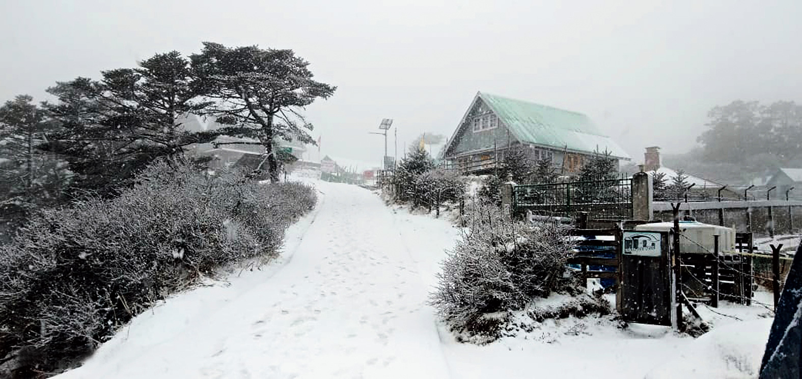 A Sandakphu neighbourhood covered in snow .