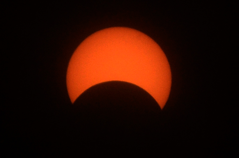 A view of the partial solar eclipse as seen from Surat on December 26