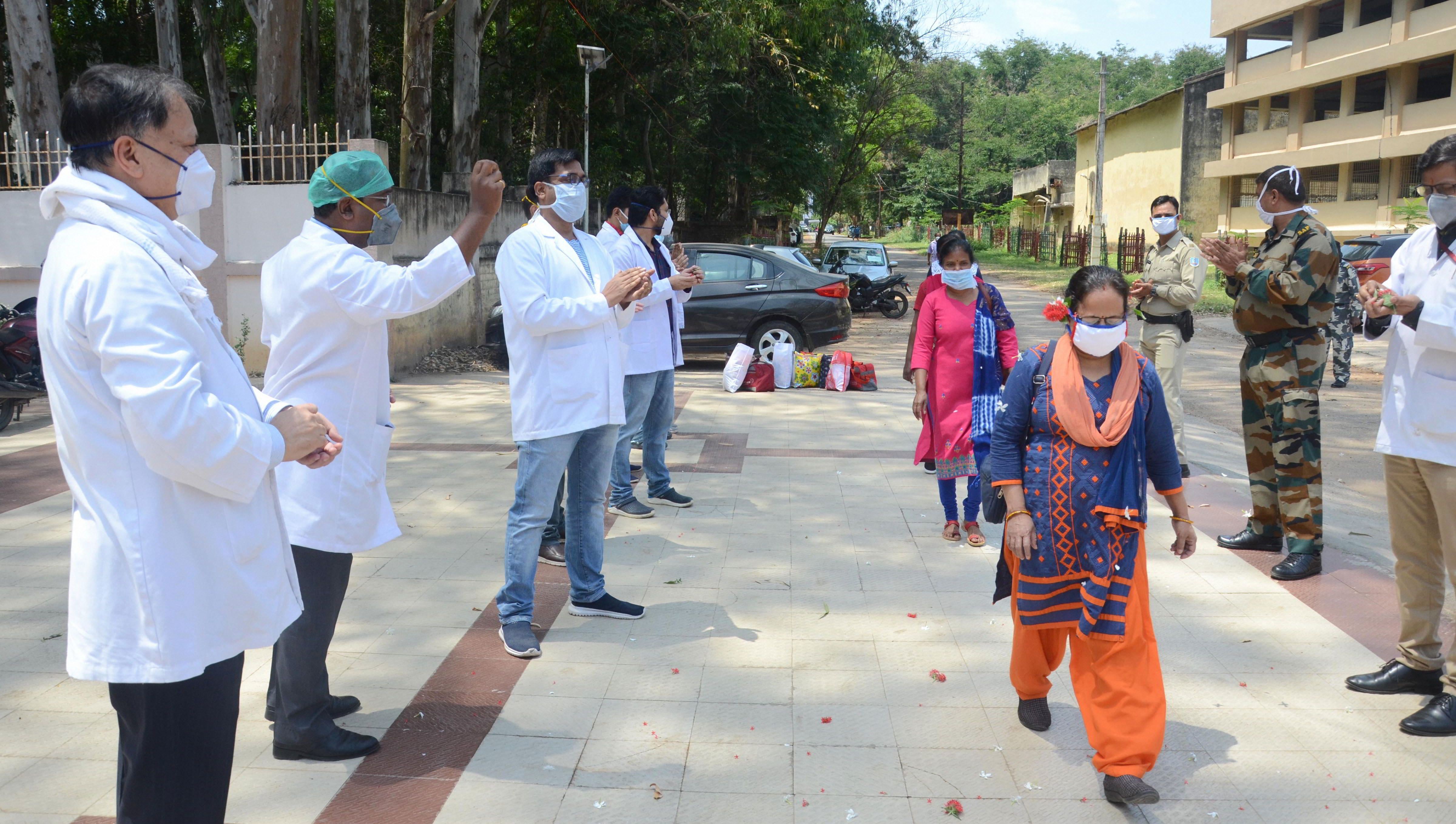 Senior doctors of Rajendra Institute of Medical Sciences applaud junior doctors who completed their quarantine period, during the nationwide lockdown imposed to curb spread of coronavirus, at Hindpiri area in Ranchi, Wednesday, April 22, 2020.