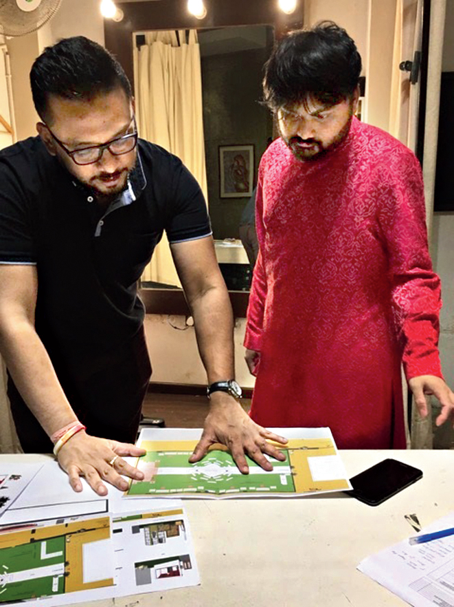 Nil with one of his workers during happier times