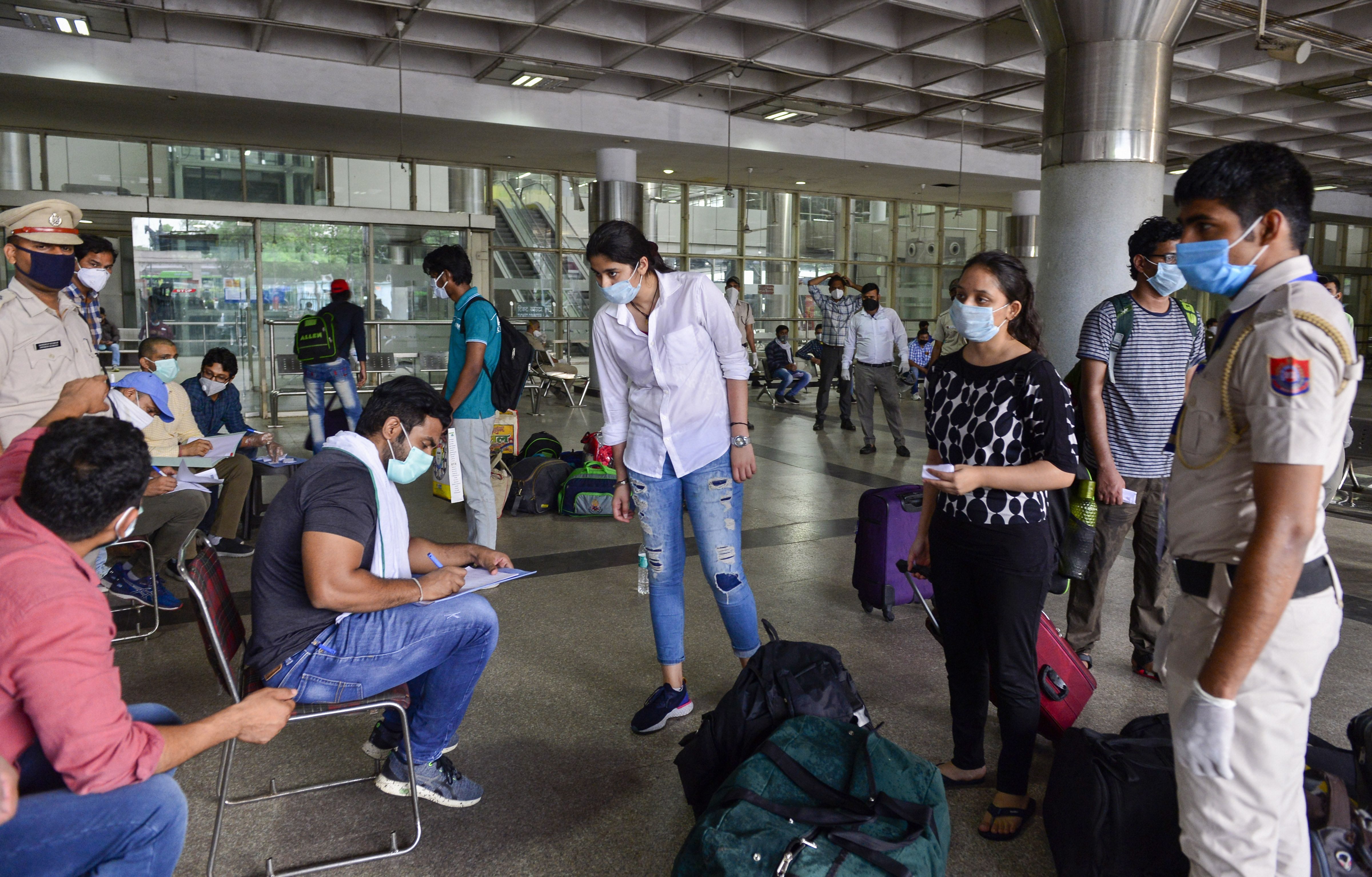 Students who were stranded in Kota due to nationwide lockdown arrive by Delhi Transport Corporation (DTC) buses at Kashmere Gate ISBT, in New Delhi, Sunday, May 03, 2020.